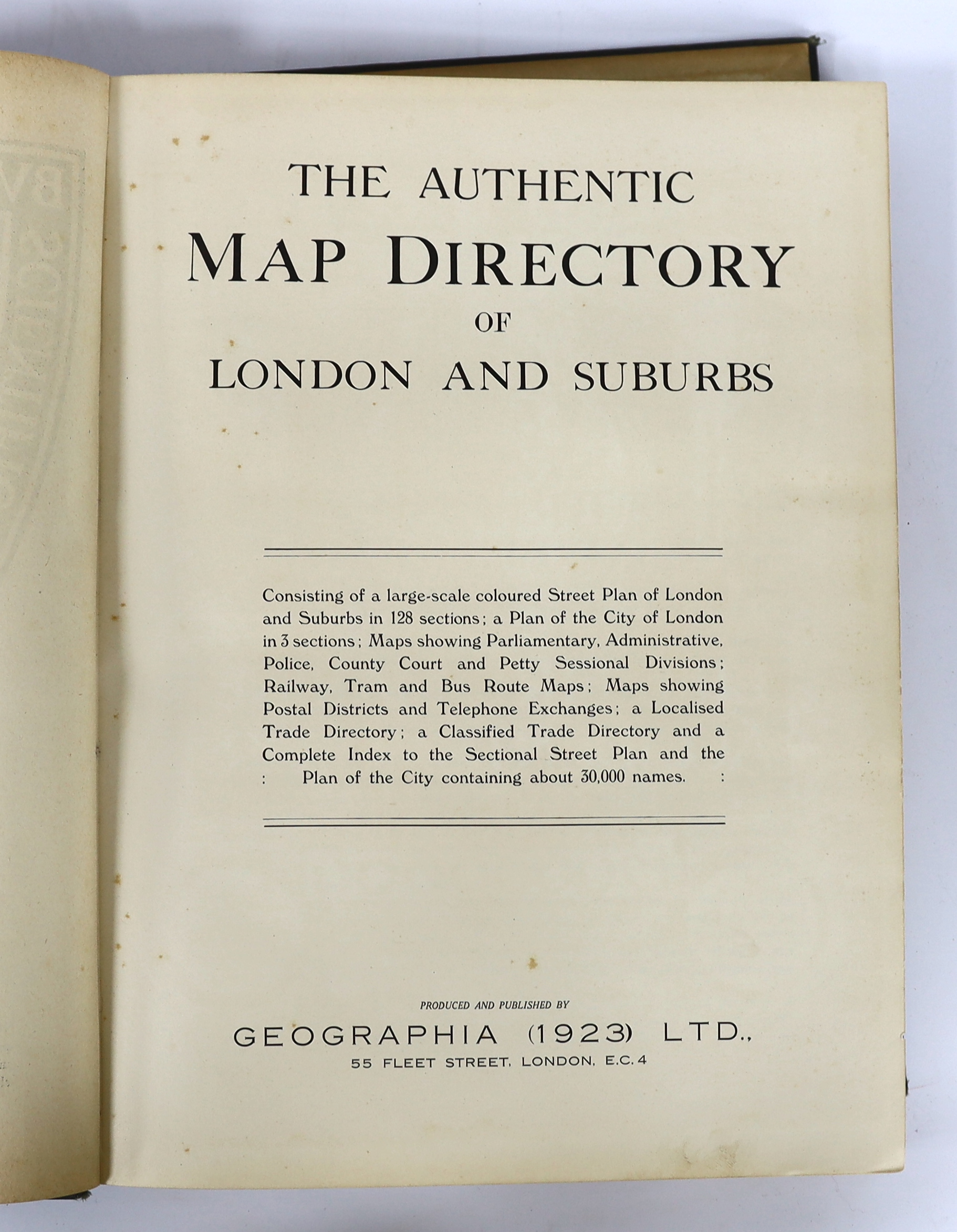 The Authentic Map Directory of London and Suburbs. Ist edition, large scale (4.5 inches to mile), comprising a d-page key, 129pp. of coloured district plans and 11 others, together with a general advertiser and index; pu